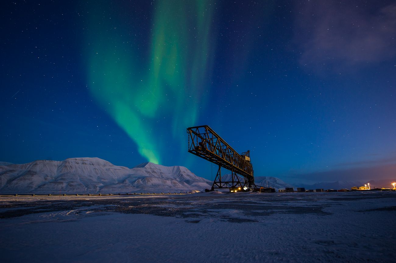 The Northern lights dancing over the mountains